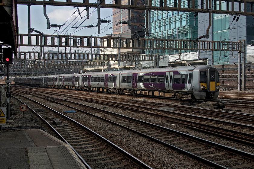 387140 & 387135, 13.42 Heathrow T5-London Paddington (1Y56, RT), London Paddington station 
 Two of Heathrow Express' dedicated Electrostars arrive at Paddington worked by 387140 and 387135. These units have been in operation on this route for less than a year but with all now in service the Class 332 stock that they have replaced have been sent to the scrap man most being broken up in South Wales at Newport docks. This does seem rather a waste of what were relatively modern electric units that I am sure some other part of the country could have made good use of. 
 Keywords: 387140 & 387135, 13.42 Heathrow T5-London Paddington (1Y56, RT), London Paddington station