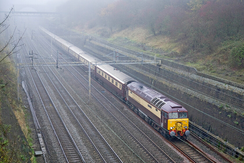 57312, outward leg of The Northern Belle, 06.39 Liverpool Lime Street-London Euston (1Z26), Roade cutting 
 Operated by DRS but branded as Northen Belle and in their colours 57312 'Solway Princess' works the outward 1Z26 06.39 Liverpool to London charter through Roade cutting. This particular locomotive was one of Virgin's Thunderbirds converted from 47330 in 2003 after having had a brief spell as 47390 between 1994 and 1995. 
 Keywords: 57312 The Northern Belle 06.39 Liverpool Lime Street-London Euston 1Z26 Roade cutting Solway Princess DRS Direct Rail Services