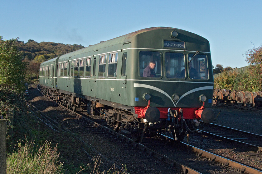 E51228 & E56062, Weybourne-Sheringham ECS, Weybourne 
 What a difference twenty-four hours make! After yesterday's cloudy and dreary weather Tuesday 18th October 2022 has started bright and sunny! Class 101 DMU made up of E51228 (leading) and E56062 gets slowly away from Weybourne at a walking pace due to a permanent speed restriction with an ECS working to Sheringham. Notice the erroneous destination blind on the leading car of the DMU. Firstly, the DMU is heading in the wrong direction for Hunstanton as it is west of this location and secondly, the town is no longer railway linked but there are constant discussions about reconnecting it to the railway network at King's Lyn. 
 Keywords: E51228 E56062 Weybourne-Sheringham ECS Weybourne Class 101 DMU first generation