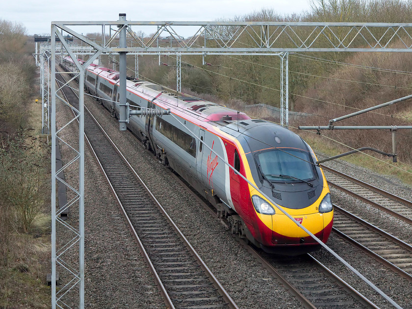 390154, VT 10.38 Liverpool Lime Street-London Euston (1A14, 9E), Bradwell SP831391 
 390154 'Matthew Flinders' forms the 10.38 Liverpool Lime Street to Euston working past Bradwell just north of Milton Keynes station. Matthew Flinders was a leading cartographer and explorer who, by circumnavigating Australia in 1801, declared it to be a continent. The Pendolino was named at Euston, very aptly as it is thought that Flinders' remains are under platform 15 as this land previously belonged to St. James' Church on Hampstead Road. 
 Keywords: 390154 1A14 Bradwell SP831391