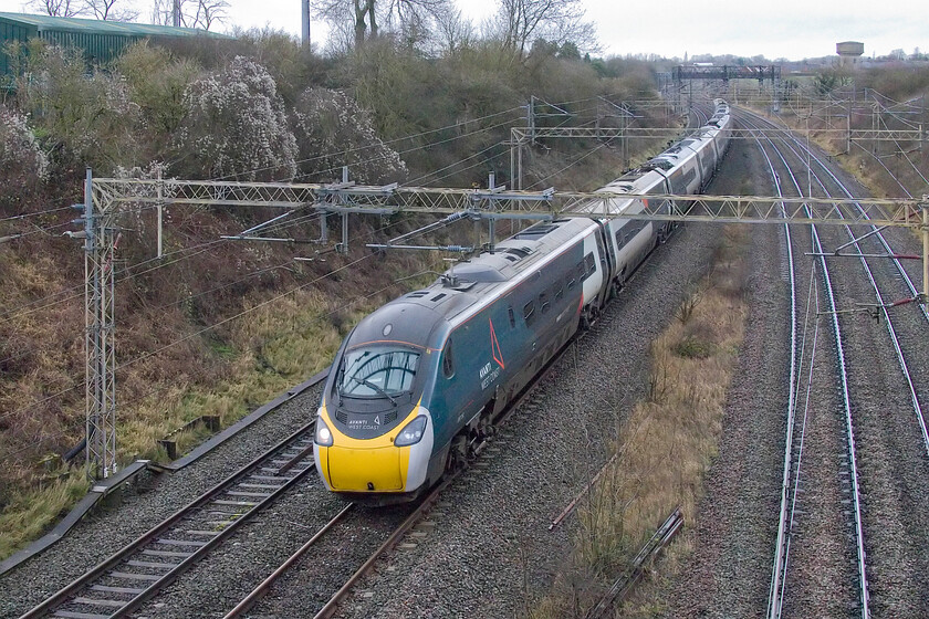 390152, VT 11.18 Preston-London Euston (9A52, RT), Victoria bridge 
 390152 takes the cambered right-hand curve just south of Roade having emerged from Roade cutting a mile or so north working the 11.18 Preston to Euston AWC service. 
 Keywords: 390152 11.18 Preston-London Euston 9A52 Victoria bridge AWC Pendolino