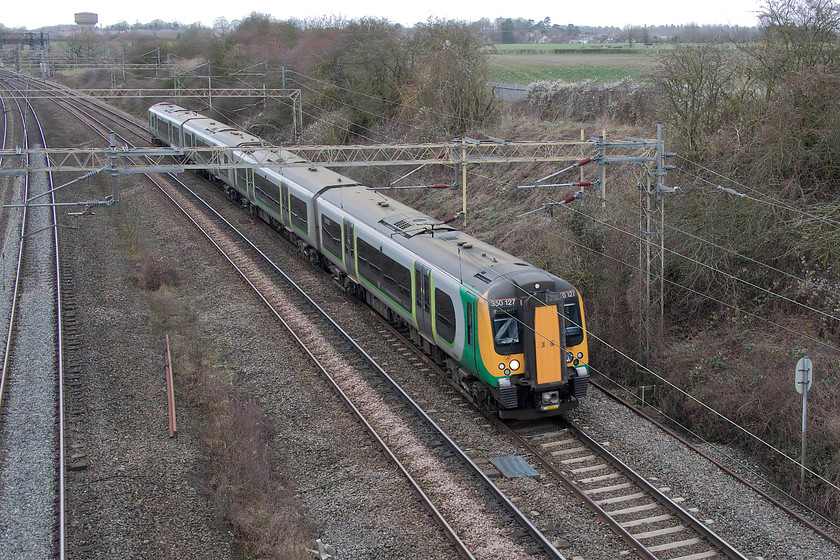 350127, LN 10.54 Birmingham New Street-London Euston (2Y06, RT), Victoria bridge 
 350127 has yet to receive the dreaded London Northwestern livery change still carrying its old London Midland colours. It is seen passing Victoria bridge south of Roade forming the 10.54 Birmingham New Street to Euston. 
 Keywords: 350127 10.54 Birmingham New Street-London Euston 2Y06 Victoria bridge