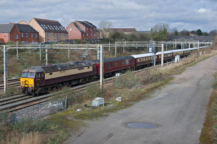 57313, 07.45 Southall WCR-Coventry (5Z68, 9L), site of Roade station 
 57313 'Scarborough Castle' brings up the rear of the 07.45 Southall WCR to Coventry empty stock move running as 5Z68. On arrival at Coventry, the stock would then form Northern Belle's afternoon charter marketed as 'Spirit Of Travel Lunch & Champagne Afternoon Tea' to Shrewsbury. With the extortionate fares paid by passengers for such trains, this would no doubt cover the costs of the empty coaching stock move seen here from West London. 
 Keywords: 57313 07.45 Southall WCR-Coventry 5Z68 site of Roade station WCR Northern Belle Scarborough Castle