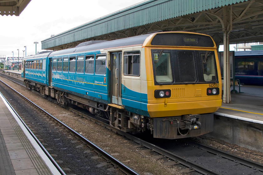 142010, AW 13.27 Ebbw Vale Town-Cardiff Central (2F30), Cardiff Central station 
 A familiar scene at Cardiff Central that travellers have enjoyed or endured depending on who you talk to! Pacer 142010 has just terminated with the 13.27 from Ebbw Vale whilst and First Great Western HST is on the adjacent platform. With the onward march of electrification, if much slower than anticipated, the HSTs will disappear and the Pacer's time is also numbered. It will be interesting to see what this viepoint will be like in five years time? 
 Keywords: 142010 13.27 Ebbw Vale Town-Cardiff Central 2F30 Cardiff Central station Arriva Trains Wales Pacer