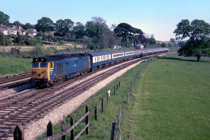 50040, 16.40 Paignton-Exeter St. David's (2B31), Aller Junction 
 We travelled down from Exeter to Newton Abbot a little earlier on this stock hauled by 50040 'Leviathan'. Having terminated at Paignton the train now returns to Exeter as the 2B31 16.40 local service. In glorious spring sunshine, the train is seen passing over Aller Junction where the West of England lines curve off to the right beyond the tall tree with the Torbay route, where the train has come, more or less straight behind. 
 Keywords: 50040 16.40 Paignton-Exeter St. David's 2B31 Aller Junction Leviathan