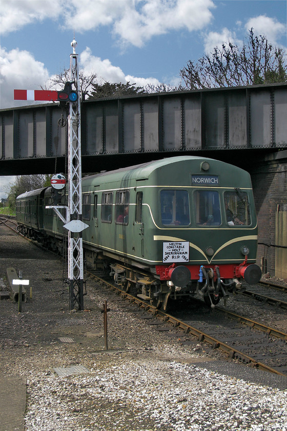 E56062 & E51228, 12.30 Holt-Sheringham, Sheringham station 
 With driving trailer E56062 leading the 12.30 Holt to Sheringham DMU service arrives at its destination in some afternoon sunshine but looks can be deceiving, it was a cold day! At the rear of the train was driving motor brake vehicle E51228. The train is wearing a small headboard to commemorate the fiftieth anniversary of the last train over this route that marked the end of once extensive M&GN (Midland and Great Northern Joint) Railway network. 
 Keywords: E56062 E51228 12.30 Holt-Sheringham Sheringham station Class 101 DMU NNR North Norfolk Railway Poppy Line