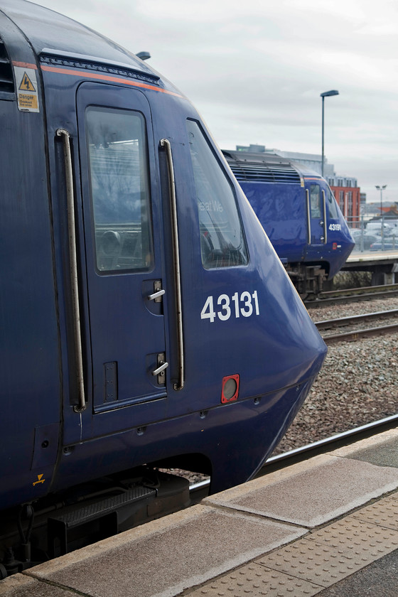 43131, GW 09.56 Cardiff-London Paddington (1L46, 6L) & 43191, GW 10.00 London Paddington-Bristol (1C09, 1E), Swindon station 
 Charles Dickens wrote 'A Tale of Two Cities,' so what about 'A Tale of two HSTs'? 43131 was part of a later batch of HSTs delivered to the Western Region in 1981 in order to introduce the South West services into Devon and Cornwall. Initially, it was part of set 253031. 43191, as part of the last batch of new build HSTs, was delivered in the summer of 1982 for the north east to south west cross-country route. This power car was part of the very final set 253055. Both these power cars are seen at Swindon station on up and down services, the 1L46 and 1C09 respectively. 
 Keywords: 43131 1L46 43191 1C09 Swindon station