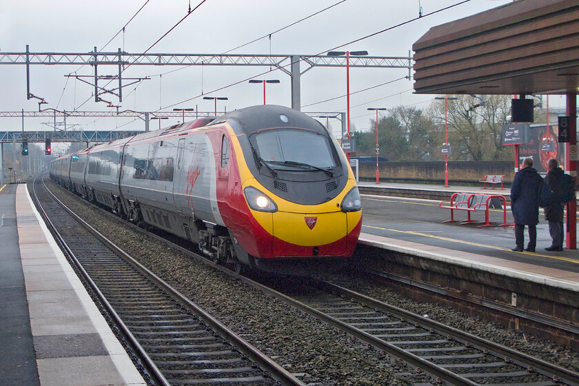 Class 390, VT 09.23 London Euston-Birmingham New Street (1G11), Birmingham International station 
 The 09.23 Euston to Birmingham New Street Virgin service arrives at Birmingham International station being worked by an unidentified Class 390 Pendolino. International station enjoys an excellent service pattern with a number of operators stopping at the station heading off in many directions. 
 Keywords: Class 390 09.23 London Euston-Birmingham New Street 1G11 Birmingham International station Virgin Pendolino