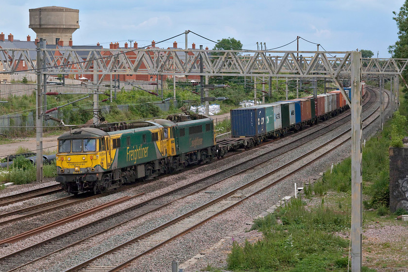 86637 & 86614, 11.13 Felixstowe North-Trafford Park (4M87, 1L), site of Roade-station 
 With the bright and strong sunshine from earlier in the day now shrouded by cloud, it felt as though a storm was brewing. In clammy conditions 86637 and 86614 are seen passing Roade leading the 4M87 11.13 Felixstowe to Trafford Park Freightliner. This pair of AL6 electrics were seen two days previously dead-in-tow on the 4A96, see...... https://www.ontheupfast.com/p/21936chg/29189145804/x86628-86639-86614-86637-12-30-crewe 
 Keywords: 86637 86614 11.13 Felixstowe North-Trafford Park 4M87 site of Roade-station Can AL6 Freightliner