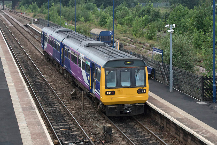 142071, NT 16.15 Doncaster-Hull (2C46, 2L), Hatfield & Stainforth station 
 142071 enters platform two at Hatfield and Stainforth station with the 16.15 Doncaster to Hull Northern service. The Pacer still carries its Northern Trains livery with no new branding having been applied. With the first Pacers now having been withdrawn, and the rest having to be out of service in the next five months, it is likely that there will be no costly vinyls produced for these ridiculed and un-loved units that have been in operation longer than the first generation DMUs that they replaced! 
 Keywords: 142071 16.15 Doncaster-Hull 2C46 Hatfield & Stainforth station