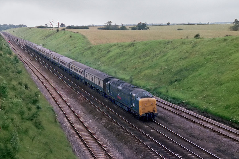 Class 55, unidentified up working, Westby SK962271 
 An unidentified class 55 storms down Stoke Bank with a King's Cross working near to the village of Westby. Quite why I have not got a record of this locomotive I am not at all sure but, looking at the nameplate, it is going to be a regiment example. Studying the Chronicles of Napier database identifies that it could be 55006 'The Fife and Forfar Yeomanry' as the nameplate looks right, it had a plated over headcode panel and it was working an Edinburgh to King's Cross train at about this time. 
 Keywords: Class 55 up working Westby SK962271