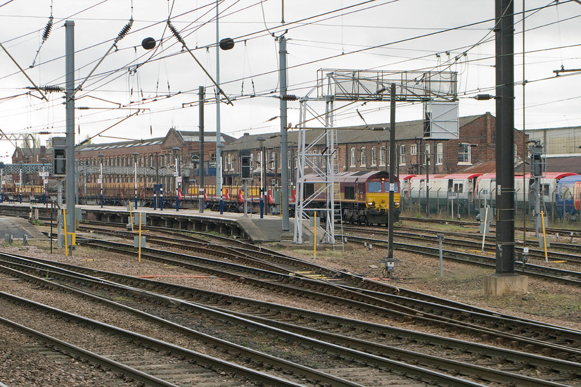 66148, 14.31 Goole Docks-Scunthorpe BSC, Doncaster station 
 On entering Doncaster station on our hst from Newcastle to Peterborough, 66148 is seen on the far side of the station. However, I have some issues with the correct identification of its working. From the WTT it appeared to be the 14.31 Goole Docks to Scunthorpe but of that was the case then it's facing in the wrong direction. Can anybody help me to confirm this working, please? 
 Keywords: 66148 14.31 Goole Docks-Scunthorpe BSC Doncaster station