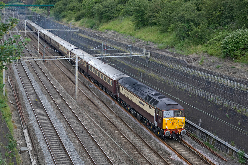 47790, 08.23 London Euston-Milton Keynes via Northampton (1Z91), Roade cutting 
 Having made the seemingly unnecessary return trip to Northampton from Milton Keynes 47790 'Galloway Princess' brings the train south again. It is leading Northern Belle's British Grand Prix charter taking racegoers to Milton Keynes for onward road transportation to Silverstone. This Class 47 has carried many numbers in its life but being largely a Scottish and East Coast locomotive it was one that I did not cop back in my younger spotting days. 
 Keywords: 47790 08.23 London Euston-Milton Keynes via Northampton 1Z91 Roade cutting Galloway Princess