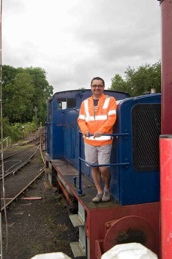 764 & me, as part of driver experience session, Pitsford sidings 
 Having successfully completed my driver experience on the Northampton and Lamport Railway without causing a major incident yours truly stands proudly on the running board of 764 'Sir Gyles Isham' back in Pitsford sidings. 
 Keywords: 764 as part of driver experience session Pitsford sidings Sir Gyles Isham Ruston & Hornsby 0-4-0