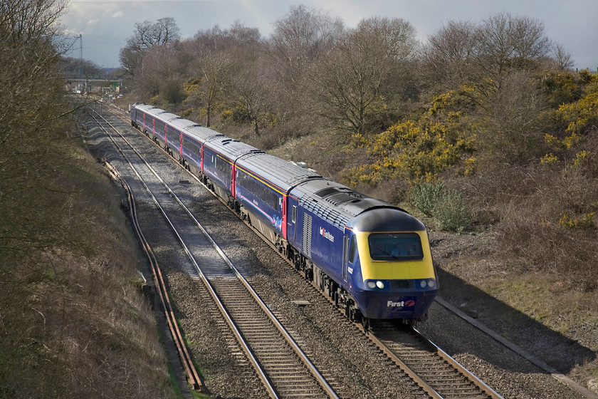 43022, GW 12.28 Swansea-London Paddington (1L62), Baulking 
 A better shot of an HST passing Baulking than the previous one, what a difference the sun makes! Power car 43022 leads the 12.28 Swansea to Paddington service. In the background, work can be seen underway constructing a new bridge over the line to carry a minor road that links together some farms. This, as is most work on the GWML at the moment, in connection with the forthcoming electrification that will mean the end for these elderly but much-loved HSTs. 
 Keywords: 43022 12.28 Swansea-London Paddington 1L62 Baulking