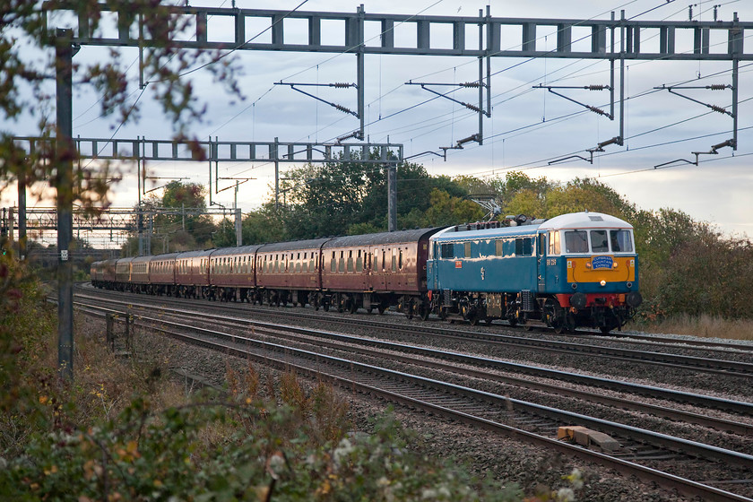 86259, outward leg of The Cumbrian Mountain Express, 07.10 London Euston-Carlisle (1Z86), Ashton Road bridge 
 It was worth the blustery walk across the field from home to capture this shot of 86259 'Les Ross/Peter Pan' leading the 1Z86 Cumbrian Mountain Express running from London Euston to Carnforth. Here steam took over to lead the train over Shap to Carlisle and then return south via the Settle and Carlisle to Farrington Junction where the AC electric took over again for the return journey. 
 Keywords: 86259 The Cumbrian Mountain Express 07.10 London Euston-Carlisle 1Z86 Ashton Road bridge