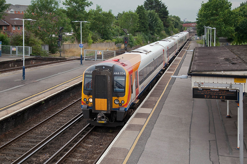 444034, SW 15.20 Weymouth-London Waterloo (1W66, RT), St 
 St. Denys station is a busy spot just north of Southampton and marks the point where the Portsmouth line diverges from the London line via Winchester. Here, 444034 passes forming the 15.20 Weymouth to Waterloo. Notice the very grey and ominous sky in the background. There were already random flashes in the distance, it was clear that the Met. Office had been quite right about the change in the weather! 
 Keywords: 444034 1W66 St. Denys station