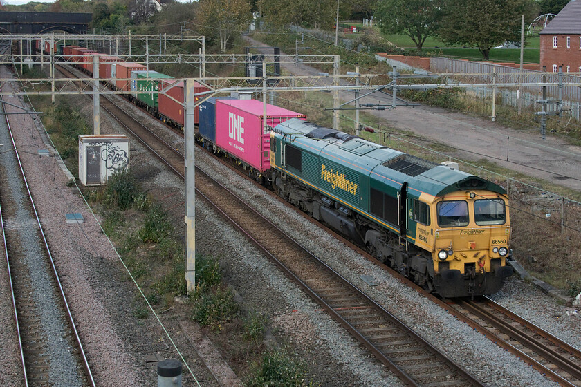 66560, 12.16 Lawley Street-London Gateway (4L46, 1L), site of Roade station 
 66560 passes the site of Roade station heading south with the daily 4M16 12.16 Lawley Street to London Gateway Freightliner. The inclusion of a ONE box immediately behind the locomotive certainly raises colours in this image where, unfortunately, the sun had just gone behind a cloud. 
 Keywords: 66560 12.16 Lawley Street-London Gateway 4L46 site of Roade station Freightliner