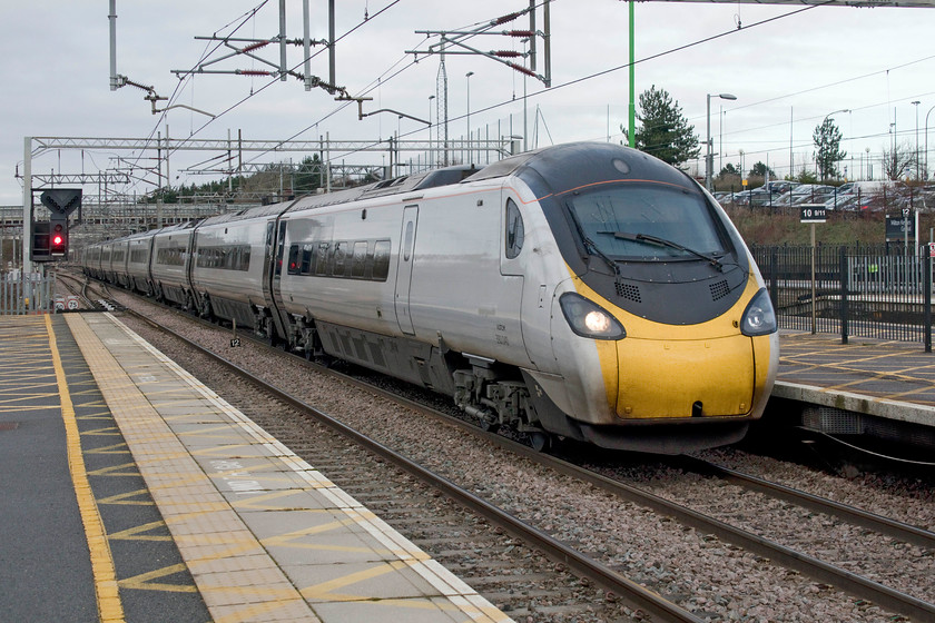 390040, VT 08.35 Manchester Piccadilly-London Euston (1A16, 1L), Milton Keynes Central station 
 390040 slows through Milton Keynes station running against a line of caution signals forming the 08.35 Manchester Piccadilly to Euston service. The running of this service and the Pendolino itself would pass to the new operator, Avanti West Coast, at midnight, some fourteen hours away. 
 Keywords: 390040 08.35 Manchester Piccadilly-London Euston 1A16 Milton Keynes Central station Virgin west coast Pendolino