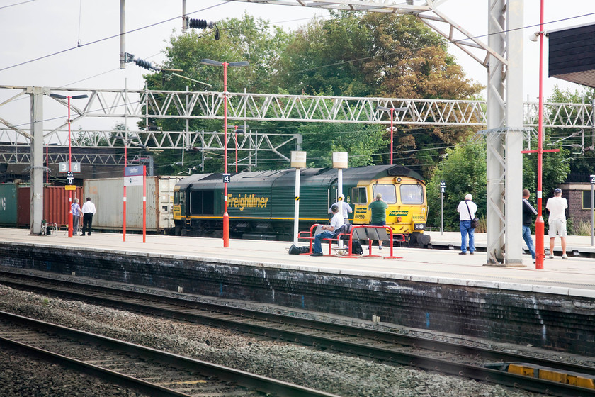 66599, 10.14 Felixstowe North-Crewe Basford Hall (4M20), Stafford station 
 Taken from my seat on the class 350 conveying us home, 66599 is seen passing through Stafford station hauling the 10.14 Felixstowe to Crewe Basford Hall Freightliner. My companion, Andy, got a better shot as he was 'bagging' the station and on the platform clear of our train. 
 Keywords: 66599 10.14 Felixstowe North-Crewe Basford Hall 4M20 Stafford station