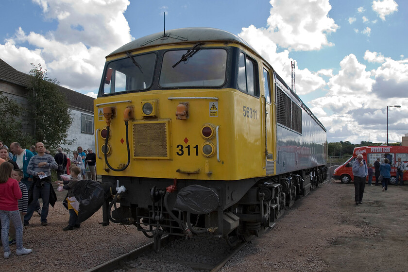 56311, on display, Mallard 75 celebrations, Grantham Yard 
 With its unfeasibly large numbers applied to the front end, 56611 sits in Grantham station's small yard specially reinstated for today's Mallard 75 event. The DCR locomotive had towed 55019 'Royal Highland Fusilier' and 4468 'Mallard' from York yesterday and then hung about in the yard generating limited interest. I suspect that the 'normals' visiting the event would be left wondering what the significance of this 1980s freight locomotive is to Mallard and the ECML and so did the enthusiast for that matter! 
 Keywords: 56311 Mallard 75 celebrations Grantham Yard