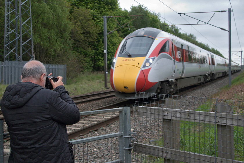 801219, GR 09.33 London King's Cross-Leeds (1D08, 1E), Penny's crossing SK630970 
 Andy will be hoping that he has secured a good photograph of 801219 at Penny's crossing near Great Rossington on his elderly Canon D60 camera. With its maximum 1/1000th second shutter speed he'll be struggling to keep the Azuma, working the 09.33 King's Cross to Leeds LNER service, free from motion blur. 
 Keywords: 801219 09.33 London King's Cross-Leeds 1D08 Penny's crossing SK630970 LNER Azuma