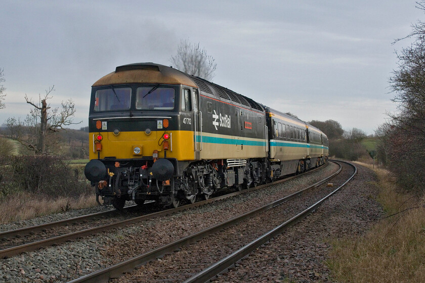 47712, outward leg of The East Anglian Push-Pull, 07.52 Crewe-Norwich (1Z23, RT), Wing SK896034 
 Evoking an era when the nationalised railways were at their best! Sectorisation brought about ScotRail under the leadership of Chris Green (of the best BR chairman it never had fame) and propelled the railways of Scotland forward. One of their creations was the push-pull rakes of Mark 3 stock with a DBSO and a dedicated 'long range' Class 47 running fast between Glasgow and Edinburgh that all carried the smart livery as seen here. 47712 'Lady Diana Spencer' passing near the village of Wing in Rutland propelling the outward leg of The East Anglian Push-Pull charter from Crewe to Norwich. 
 Keywords: 47712 The East Anglian Push-Pull 07.52 Crewe-Norwich 1Z23 Wing SK896034 ScotRail Lady Diana Spencer