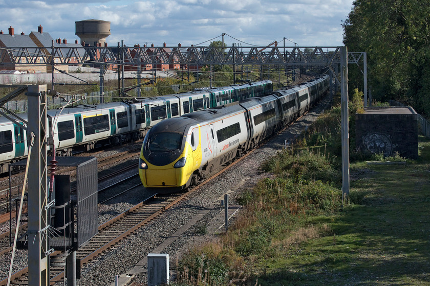 390042, VT 13.43 London Euston-Blackpool North (9P77, RT), site of Roade station 
 Masked 390042 speeds through Roade approaching the site of the old station working the 9P77 13.42 Euston to Blackpool North service. I am constantly surprised at the lack of photographs that I have of these services to the Lancashire Coast so every time I see one approaching on RTT I try to get a photograph. Interestingly, I took a photograph of this same Pendolino wearing its yellow mask at the same location on the day (15.06.20) it became mandatory to wear a face-covering on public transport back in the high summer, see..... https://www.ontheupfast.com/p/21936chg/29197581804/x390042-17-30-london-euston-glasgow 
 Keywords: 390042 13.43 London Euston-Blackpool North 9P77 site of Roade station Virgin Pendolino AWC Avanti West Coast