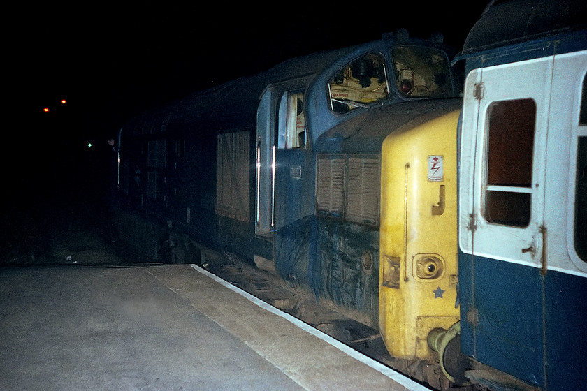 37204, return leg of the Pennine Explorer, Rotherwood Exchange sidings-Cardiff Central, Cheltenham Spa station 
 For some unknown reason, the final return leg of the Pennine Explorer railtour from Birmingham New Street to Cardiff Central was handled by a single 37204 as opposed to the double headed affair on the way out. Here, 37204 leaves Cheltenham station taken using the flash attached to the base plate hot shoe on the Rollie B35 camera. Our party alighted at Cheltenham in order to get a connection home in time for for the last train from Bristol to Bradford-on-Avon. Our haulage from Cheltenham was 47262 followed by a class 118 DMU onwards from Bristol. 
 Keywords: 37204 Pennine Explorer Rotherwood Exchange sidings-Cardiff Central Cheltenham Spa station