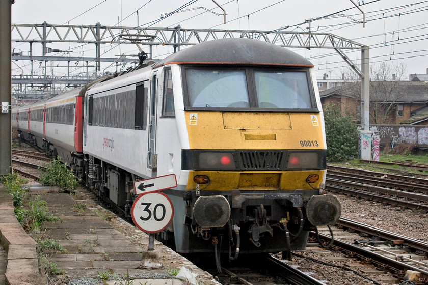 90013, GE 13.00 London Liverpool Street-Norwich (1P30, 1E), Bethnal Green station 
 Not a great picture in terms of its composition and it's a going-away shot but, unbelievably, it's my only picture to date of 90013. This completes the set in terms of a picture of all of the fifteen class 90s operated by Greater Anglia. It is propelling the 13.00 Liverpool Street to Norwich past Bethnal Green station. 
 Keywords: 90013 13.00 London Liverpool Street-Norwich 1P30 Bethnal Green station