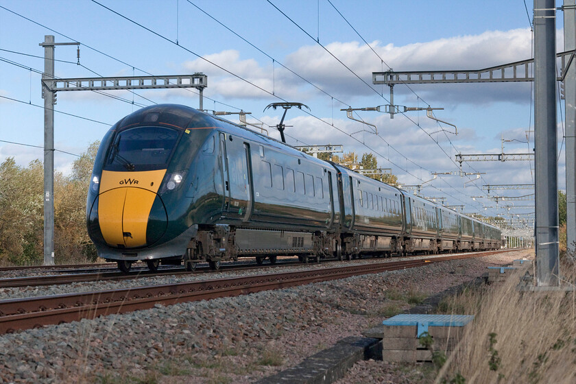 800309, GW 14.37 London Paddington-Penzance (1H86, 14L), Grove foot crossing SU393911 
 Reverting back to my 24-105 zoom on the Canon full frame I have managed a more conventional image of 800039 working the 1H86 14.37 Paddington to Penzance service (via Bristol) past Grove (Oxfordshire). Unfortunately, as it approached at line speed the sun just went behind a cloud putting the front in half shadow but with the rear of the train still in full sun. If I had stuck with the 80-200 zoom I would probably have got the whole train in the sun! I am in a safe position at a foot crossing inside a timber corral so as not to expose myself to any possible danger or to spook the driver. 
 Keywords: 800309 14.37 London Paddington-Penzance 1H86 Grove foot crossing SU393911 GWR IET