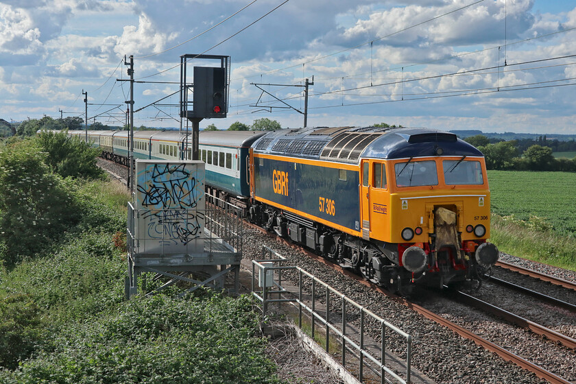 57306, 16.08 Wembley Yard-Burton Ot Wetmore (5Z63, RT), Milton Crossing 
 57306 brings up the rear of the 5Z63 16.08 Wembley Yard to Burton-ot-Wetmore empty stock move. 57310 is leading the train seen at Milton crossing just north of Roade on the Weedon loop know as the 'old route'. Both former Virgin Thunderbirds were painted by UKRL4 at Loughborough and look very smart in their GBRf livery. 
 Keywords: 57306 16.08 Wembley Yard-Burton Ot Wetmore 5Z63 Milton Crossing