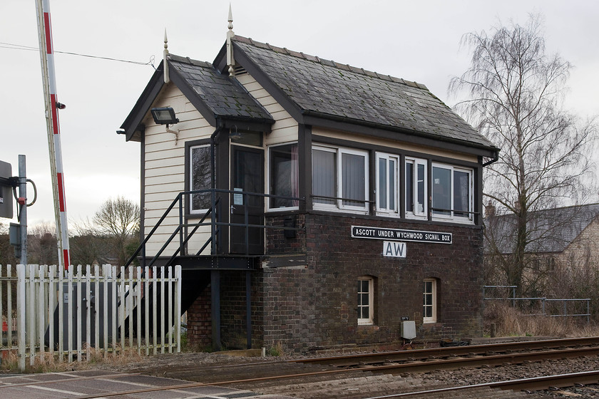 Ascott-under-Wychwood signal box (GWR, 1883) 
 On our return journey from Box, we made a modest detour. We called at Ascott-under-Wychwood for Andy to 'cop' the station and so I could photograph the signal box. The only other picture that I had was taken from a passing train. This is a classic Great Western box dating from 1883 and is situated at the level crossing in the village. It used to be the fringe box at the start/end of a 14 mile single track section of the Cotswold Line to Wolvercote Junction. The line was redoubled as far as Charlbury in 2011. 
 Keywords: Ascott-under-Wychwood signal box GWR, 1883