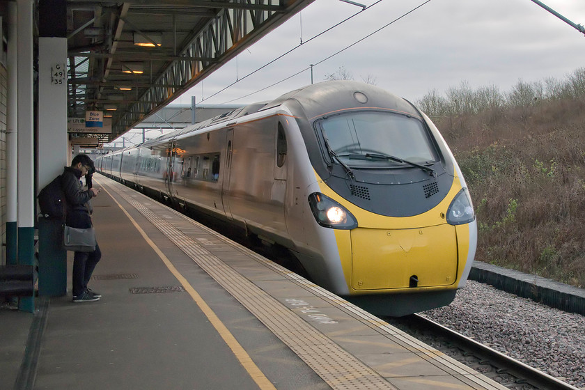 390009, VT 09.23 London Euston-Birmingham New Street (9G11, 1L), Milton Keynes Central station 
 39009 'Treaty of Union' sweeps through a grey Milton Keynes forming the 09.23 Euston to Birmingham New Street service. Now devoid of any livery and branding, this will be one of the Pendolino's final runs in the hands of Virgin with the franchise coming to an end in the next twelve hours or so. 
 Keywords: 390009 09.23 London Euston-Birmingham New Street 9G11 Milton Keynes Central station Pendolino Virgin West Coast