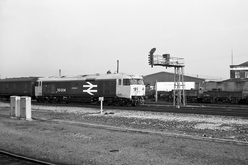 50004 & LMS van in consist, loaded return test run to Doncaster, Darlington station 
 I go all the way to the northeast from my home in the West Country and see a Class 50, however, I consoled myself as this was a historic photograph for me. It was my first photograph and sighting of a 'large logo' locomotive and I remember being astounded by it when it passed Darlington station on the up avoider line. I must have had my camera cocked and ready by chance as I would not have had a view of its approach. 50004 'St. Vincent' is seen on a loaded return test run that would have started at Doncaster usually going as far as Tyne Yard before returning south. Subject to all being well the refurbished Class 50s often took a NE to SW service home from York. Even though this photograph was taken on 31st October it is recorded * that 50004 had been released into traffic three days previously. I believe that St. Vincent was the second member of the class to receive the large logo livery after 50023 'Howe'. Notice the LMS van tucked in behind the locomotive as part of its load.

* Haynes, The English Electric Class 50, 2017 
 Keywords: 50004 LMS van loaded return test run to Doncaster Darlington station St Vincent Class 50