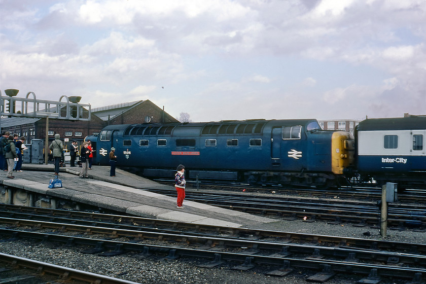 55016, 14.05 London King's Cross-York (1L43), York station 
 I would not normally publish a repeat image of a train simply arriving at a station, but this particular one is a study of a time that many of us enthusiasts grew up with, but one that is not seen today. 55016 'Gordon Highlander' arrives at York leading the 14.05 from King's Cross observed by a raft of enthusiasts many of whom have a note pad and pen in hand eagerly noting the Deltic's arrival. A close study of the photograph also reveals some period attire such as the flares and a superb example of the very popular (at the time) lumberjack jacket! In addition, there is also the accoutrements required for a day's spotting, for example, binoculars, sports bags and a rucksack! 
 Keywords: 55016 14.05 London King's Cross-York 1L43 York station Gordon Highlander Deltic