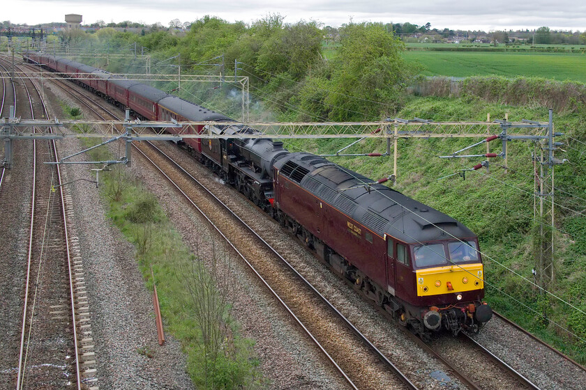 47812 & 45407, 09.33 Carnforth Steamtown-Southall WCR (5Z42, 9E), Victoria bridge 
 There was talk on the internet that Black 5 45407 'The Lancashire Fusilier' would lead the 5Z42 09.33 Carnforth to Southall empty stock move. However, the decision was taken to pilot the train with 47812 attached to the front with the Black 5 then in light steam. Unfortunately, being double-headed meant that the two locomotives did not fit in the space at my chosen spot at Victoria bridge just south of Roade. The drab WCR colour scheme applied to their stock and the Type 4 does not really stand out on this dull April day! 
 Keywords: 47812 45407, 09.33 Carnforth Steamtown-Southall WCR 5Z42 Victoria bridge The Lancashire Fusilier West Coast Railway