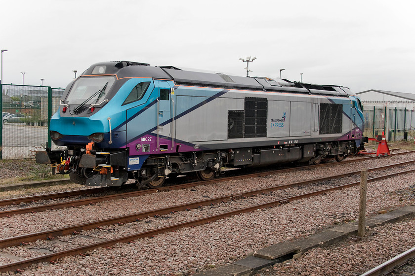 68027, stabled, York station 
 I am not at all convinced by this TP livery applied to their new fleet of class 68s. I find it 'messy' and cluttered. I am also not keen on seeing UK trains with no yellow warning panels but this is something that we will see more of as time progresses. 68027 sits stabled adjacent to York station. 
 Keywords: 68027 York station