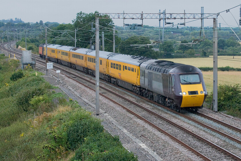 43357 & 43277, 11.59 Crewe Up & Down Pottery Loop-Derby R.T.C via London Euston (1Q29, RT), Blisworth 
 A mix-match Network Rail NMT passes Blisworth on the outward leg of its Crewe to Derby high-speed run. Running as 1Q29 it left Crewe's Pottery Loop at just before 12.00 and made rapid progress being pathed in between Pendolino workings. Former CrossCountry 43357 leads the train with ex-LNER 43277 bringing up the rear. The later now wears a distinctive Colas colour scheme and branding. 
 Keywords: 43357 43277 11.59 Crewe Up & Down Pottery Loop-Derby R.T.C via London Euston 1Q29 Blisworth