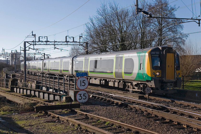 350120, LM 09.49 London Euston-Birmingham NewStreet, Northampton station Car park 
 350120 works the 09.49 Euston to Birmingham New Street into Northampton taken from the station car park. With the demolition of the old station and the construction of the new one about to start, I wonder if access to this useful spot will still be possible in the future. If not, it will be a big disappointment to the local enthusiasts. 
 Keywords: 350120 09.49 London Euston-Birmingham New Street Northampton station Car park London Midland Desiro