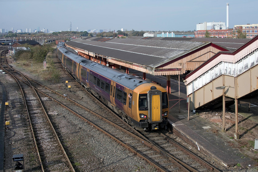 172337 & class 172, LN 11.40 Whitlocks End-Kidderminster (2K23, RT), Tyseley station 
 With the skyscape of Birmingham city centre in full view, 172337 and a classmate pass slowly through Tyseley station forming the 11.40 Whitlocks End to Kidderminster service. Tyseley station has been preserved as a traditional Great Western station but is now looking a little tired and in need of a lick of paint. The extensive yards that make up Tyseley depot can be seen to the left of this picture where many units are maintained and serviced. 
 Keywords: 172337 11.40 Whitlocks End-Kidderminster 2K23 Tyseley station