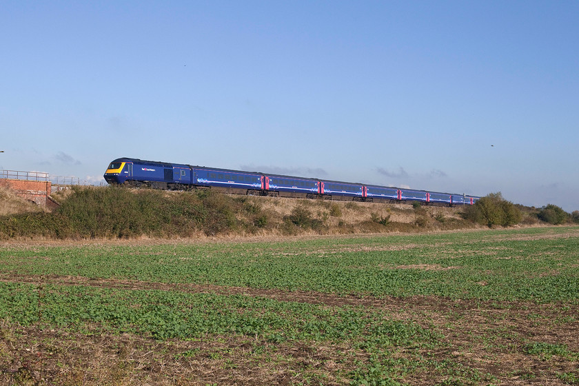 43040, GW 10.54 London Paddington-Brisol Parkway (1U25), Knighton SU278890 
 With absolutely no signs of the advancing electrification works in sight, 43040 'Bristol St. Philips Marsh' passes along an embankment near the village of Knighton that itself is close to Uffington in Oxfordshire. Unfortunately, I have not quite framed the HST, that was working the 10.54 Paddington to Bristol Parkway, properly just missing off the rear power car. Now that the fog has cleared, it has turned into a stunning autumn morning. 
 Keywords: 43040 0.54 London Paddington-Brisol Parkway 1U25 Knighton SU278890