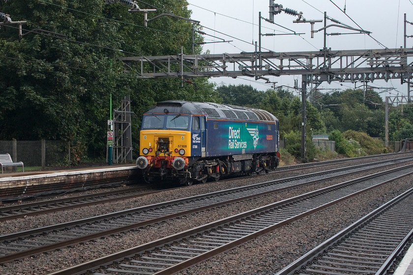 57308, 15.20 Crewe Gresty Bridge-Rugby LE, Rugeley Trent Valley station 
 57308 'Jamie Ferguson' trundles southwards as the 15.20 Crewe to Rugby light engine move. DRS now operate the contract that places the Thunderbird locomotives at strategic locations the length of the WCML. They are in a position to rescue a failed Pendolino or Voyager in order to keep the line in operation with the minimum of fuss. Throughout the week, there are various light engine moves between the places where they are stabled as seen here at Rugeley Trent Valley station. 
 Keywords: 57308 15.20 Crewe Gresty Bridge-Rugby Rugeley Trent Valley station