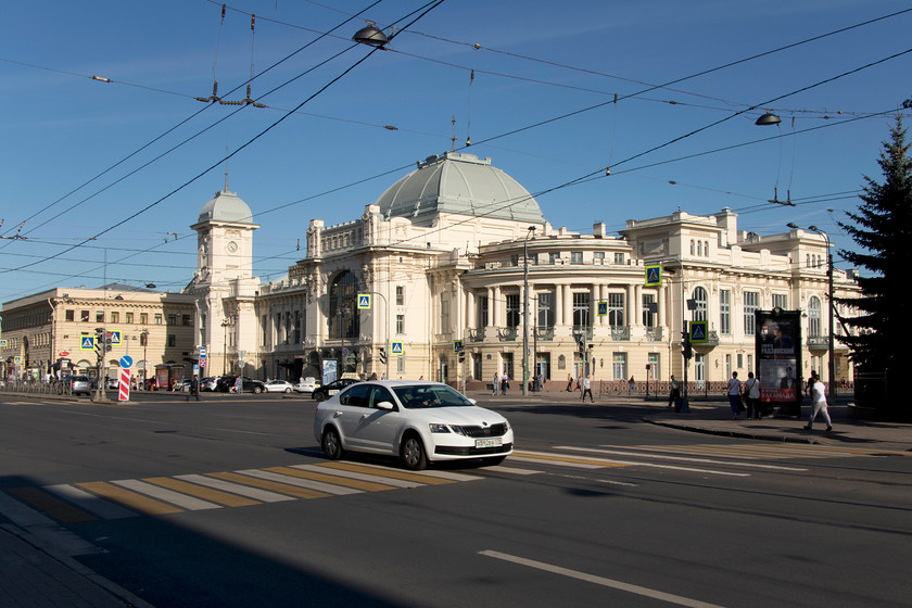 Station frontage, St. Petersburg Vitebsk station 
 This stunning station frontage of Vitebsk is the finest in St. Petersburg and one that they are justifiably most proud of. This building replaced the original wooden building dating from 1837 being built in 1904 in the Art Nouveau style. However, I think that it is more akin to an Indian place of time kind! Trains from this grand building go to many Russian cities, CIS countries and to the rest of Europe. Specific places include the Baltic countries, Berlin, Budapest, Warsaw, Prague, Adler, Smolensk, Kiev, Lviv, Gomel, Chisinau, Riga and Vilnius. The station also serves the suburbs of St. Petersburg ostensively to the south of the city. Access to the suburban platforms was via the dreaded barriers, with my Russian not up to explaining that I wanted to pop on, spend a little time and take some pictures so I gave up. I also gave up when I entered the front concourse seeing armed guards with passengers going through metal detectors and their luggage going through airport style x-ray machines. This was before the ticketing area had been entered! I later fund out this was the norm and it was easy to just pass through as any other customer with not an eyelid raised, I wish that I had the confidence to do this here at Vitebsk station. 
 Keywords: St. Petersburg Vitebsk station