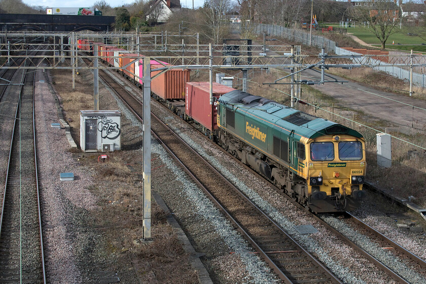 66554, 12.16 Lawley Street-London Gateway (4L46, 4L), site of Roade station 
 The 12.16 Lawley Street to London Gateway 4L46 Freightliner passes the site of Roade station in some welcome afternoon sunshine. Whilst this seemingly anonymous Class 66 leads the train, for me, it was a photographic cop making my afternoon sortie worthwhile! 
 Keywords: 66554 12.16 Lawley Street-London Gateway 4L46 site of Roade station Freightliner