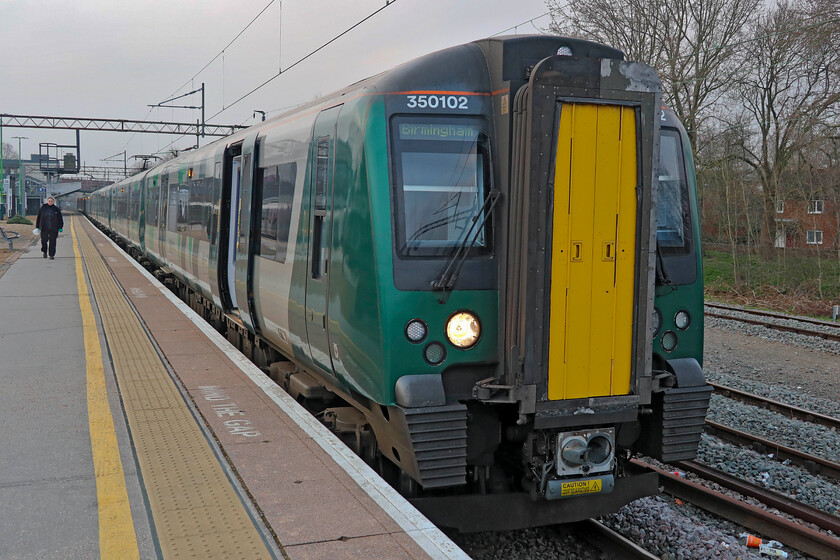 350102, LN 06.21 London Euston-Birmingham New Street (1Y11, 2L), Northampton station 
 Our first train of the day on our trip to Lancaster waits to leave Northampton station. Andy and I travelled aboard 350112 working the 06.21 Euston to Birmingham New Street from Northampton to Coventry. Being a 'peak hour' service in the middle of the morning commute it was once again noticeable how quiet both the train and Northampton station were reinforcing the almost total disappearance of the pre-COVID morning rush. 
 Keywords: 350102 06.21 London Euston-Birmingham New Street 1Y11 Northampton station London Northwestern desiro