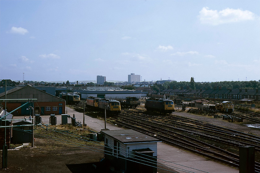 82003, 84006, 84008, 84005 & 84007, awaiting attention, Crewe Works 
 A number of AC electrics await their fate at Crewe Works. Unfortunately, I suspect that these locomotives are awaiting an appointment with the scrap man rather than a visit to the paint shop. Of the five locomotives seen here, only 82003 was still in service awaiting attention as it was not withdrawn until 1983. As for the rest, 84006 had been withdrawn for twenty months and had just two months before cutting a short distance away at Gresty Bridge. 84008 had a month before official withdrawal so I suspect that it was here to stay until that date. 84005 had been withdrawn since April 1977 but was not moved and cut up at Long Marston until March 1985. Finally, 84007, at the back on the left, had been withdrawn a staggering two and a half years by this time, witness its very faded yellow front end. 
 Keywords: 82003 84006 84008 84005 84007 Crewe Works