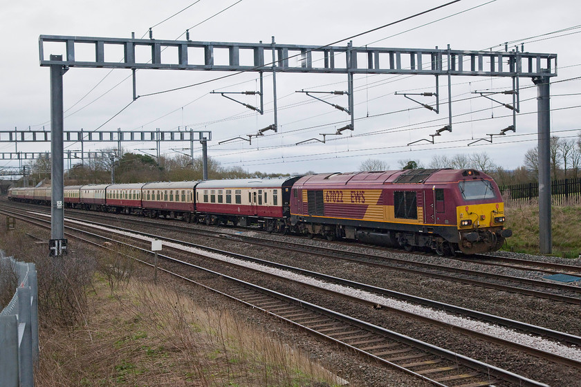 67022 outward leg of The Shoulder of Lune, London Euston-Heysham Harbour (1Z18), Ashton Road bridge 
 66022 leads a smashing set of Mk1 stock provided by DB cargo at the head of The Shoulder of Lune railtour run by UK Railtours. It is seen on the down fast passing Ashton Road bridge just south of Roade on the southern WCML. 
 Keywords: 67022 The Shoulder of Lune 1Z18 Ashton Road bridge