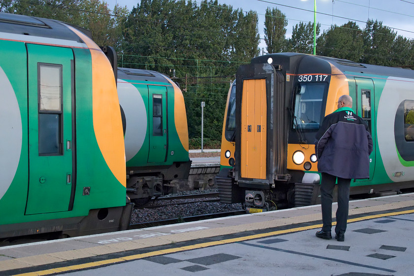 350102 & 350117, LN 06.22 Coventry-London Euston (1Y84, 5L) & 350105, LN 05.34 London Euston-Liverpool Lime Street (9F35, 13L), Northampton station 
 Despite Govia London Midland losing the franchise nearly two years ago, many of the class 350 Desiros still carry their livery albeit with vinyl branding on their flanks. Three class 350s are seen at a busy Northampton station. To the left, 350102 arrived from Kingsheath sidings sometime earlier but remained locked out of use frustrating the many commuters standing on the platform waiting to board it. To the right, 350117 is slowly approaching ready to join the other unit working the 06.22 from Coventry. The combined units will then work forward to London Euston. In the background, 350105 is leaving with the 05.34 Euston to Liverpool Lime Street. 
 Keywords: 350102 350117 06.22 Coventry-London Euston 1Y84 350105 05.34 London Euston-Liverpool Lime Street 9F35 Northampton station