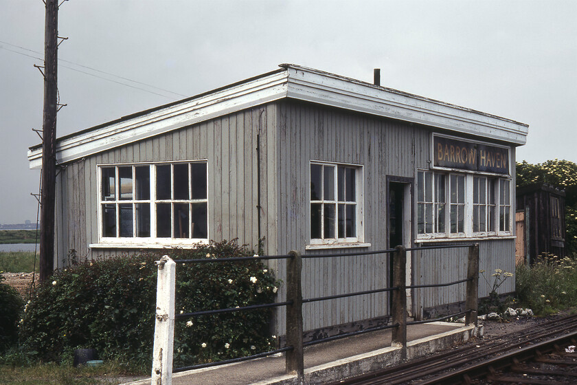 Station building, Barrow Haven station 
 The delightful station waiting room at Barrow Haven is seen on the estuary side of the tracks. Located at a very remote spot on the flats of the Humber estuary it had a rather exposed platform that was located opposite this building. Passengers had to make their way along the approved walking route seen behind the railings, cross the occupation level crossing, and walk up the platform ramp to access the infrequent trains. According to Chris Bates' website, the sturdy wooden building was moved to Barrow Haven from Brocklesby at the start of the twentieth century. He also states that the building was saved from demolition by being taken to a private railway museum at Kirton Lindsey. It was later moved to the Burgh le Marsh railway museum, but since that museum closed its present whereabouts are unknown. 
 Keywords: Station building Barrow Haven station